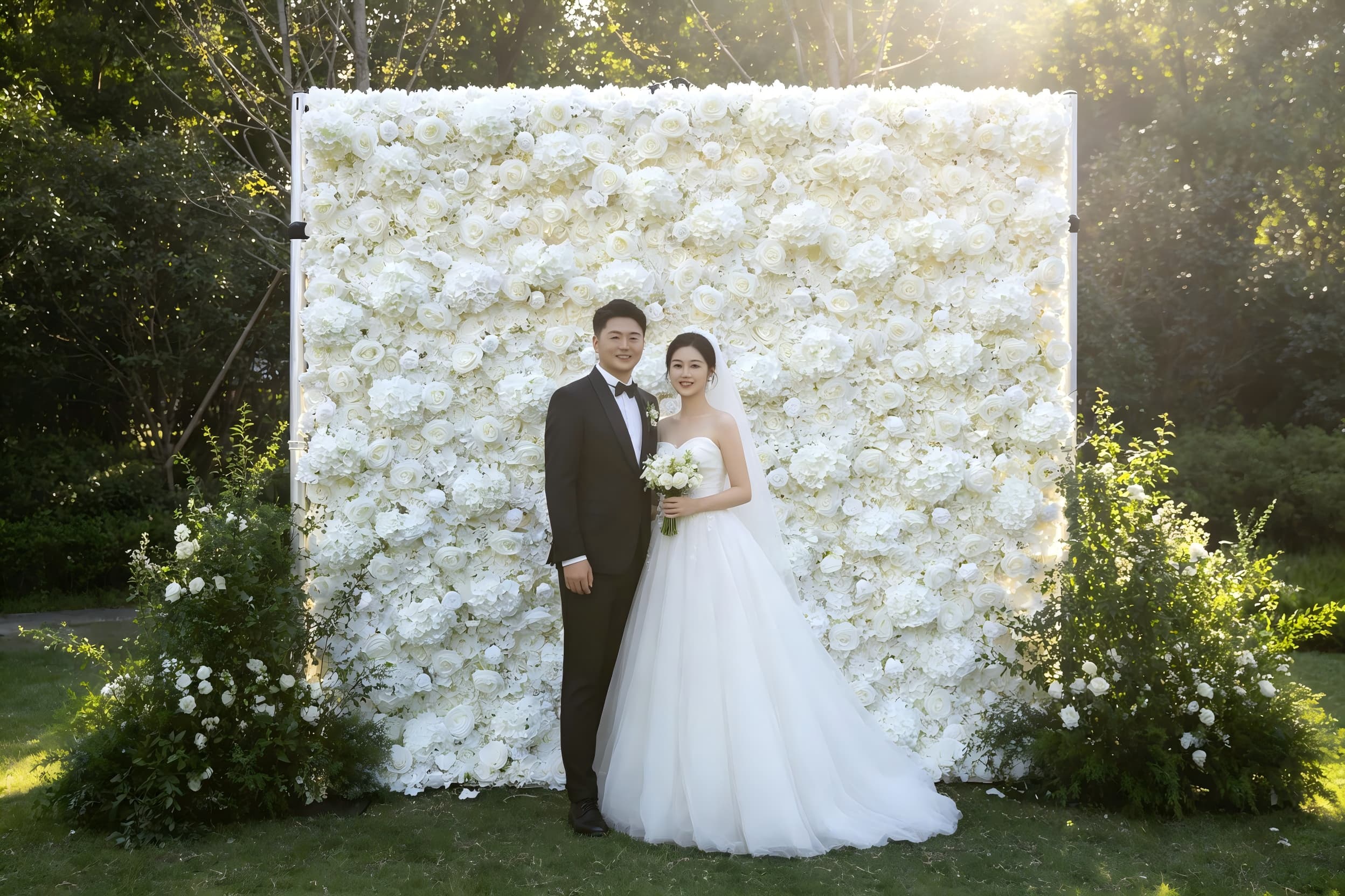 white floral backdrop outdoor garden wedding ceremony