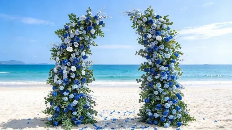 Blue White Crescent Flower Arch at Coastal Modern Wedding Ceremony