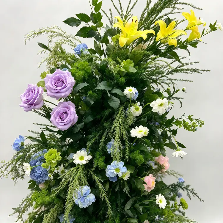 Close-up Detail of Colorful Mixed Purple Rose Yellow Lily Blue Hydrangea White Daisy Crescent Arch