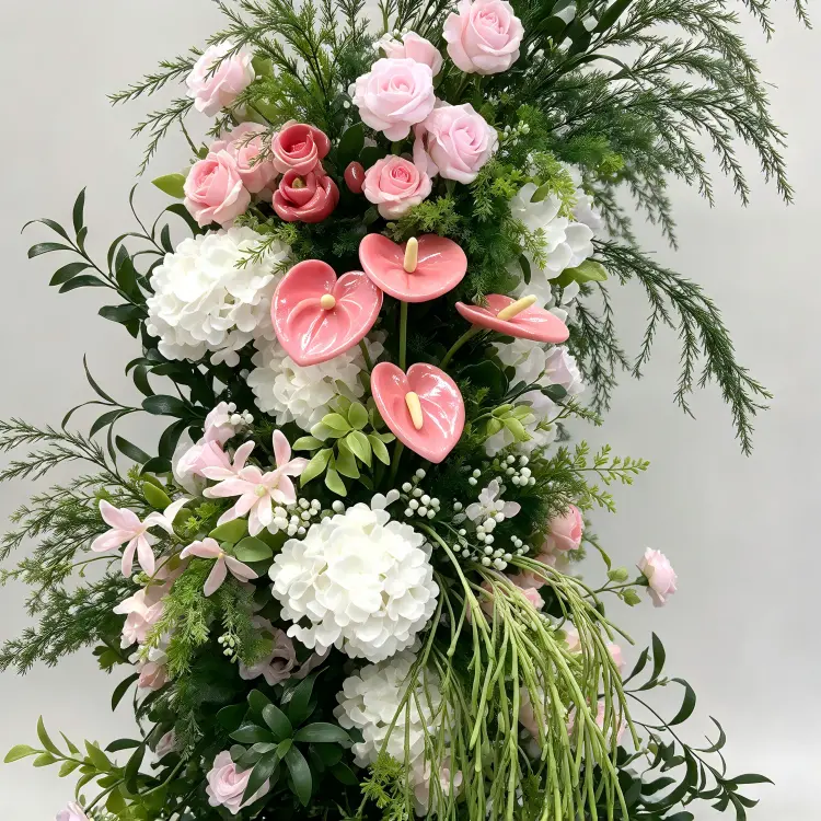 Close-up Detail of Pink Anthurium Waxy Spathe Pink Rose White Hydrangea Trailing Greenery Crescent Arch