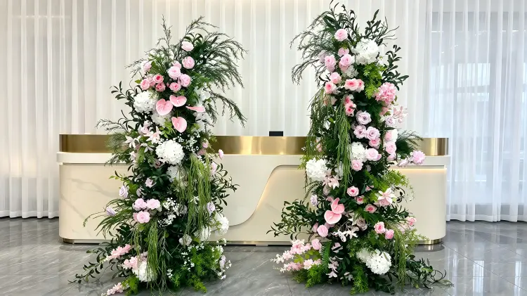 Pink Anthurium Crescent Arch at Corporate Event Lobby with Gold Trim Reception Desk