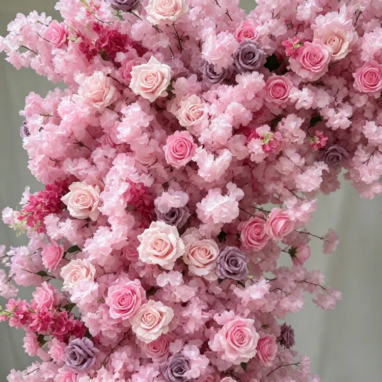 Close-up Detail of Multi-Tone Pink Roses Hydrangeas and Green Foliage on Artificial Flower Arch
