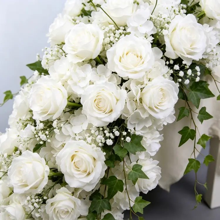 Close-up Detail of White Artificial Flower Garland with Silk Roses Hydrangea and Baby's Breath