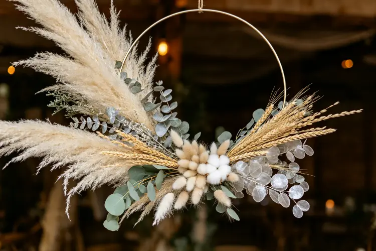 Pampas grass and dried floral hoop with eucalyptus, wheat, and bunny tails in neutral earthy tones